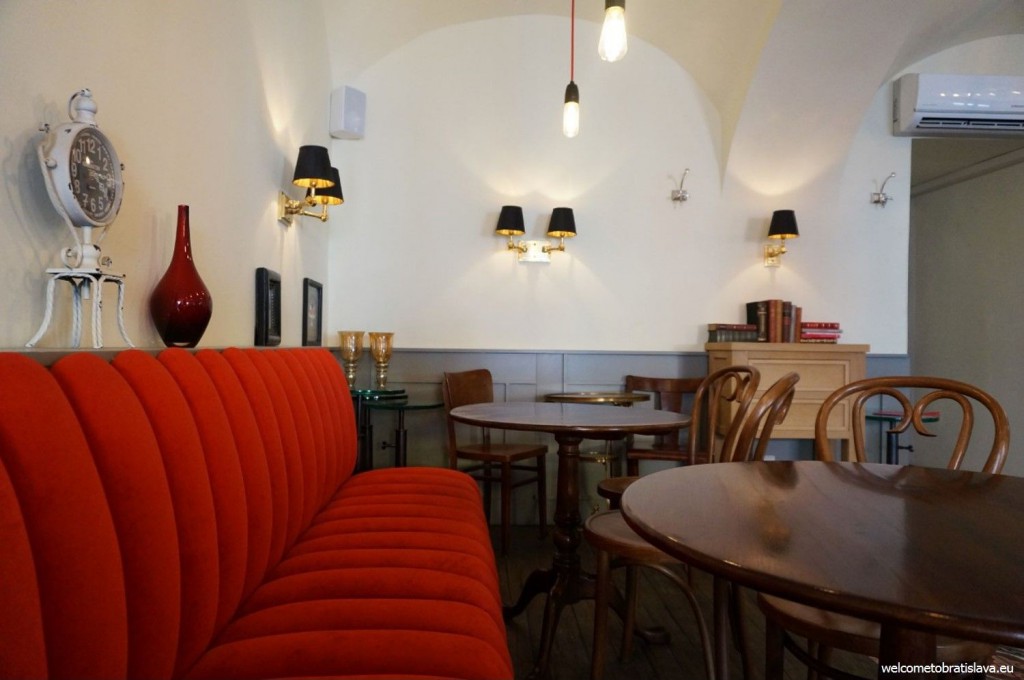 Mondieu's back room with a huge red sofa